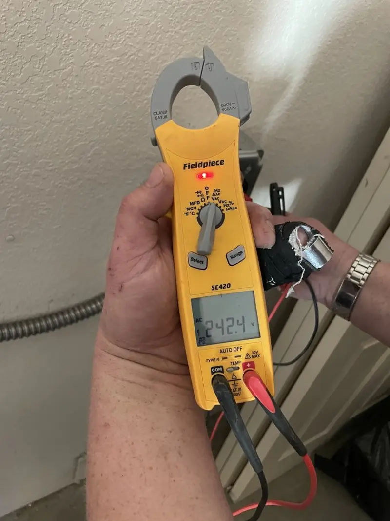 Voltage testing with clamp meter during Generator Installation in Somers